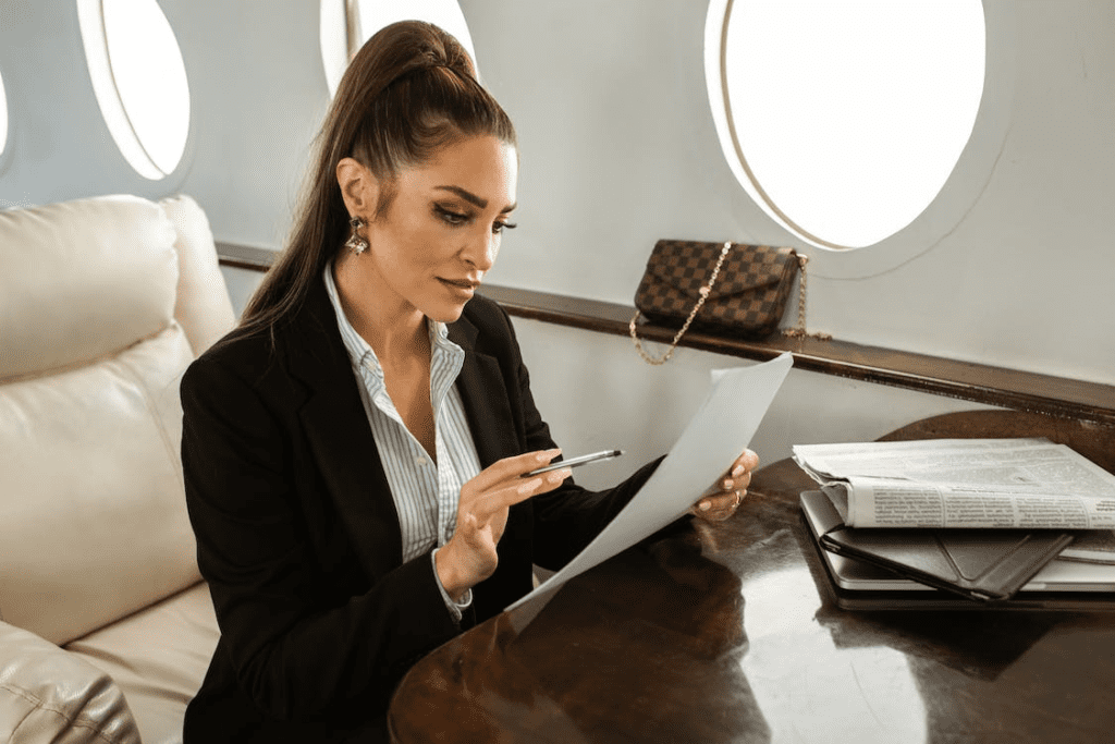 A businesswoman working during her flight