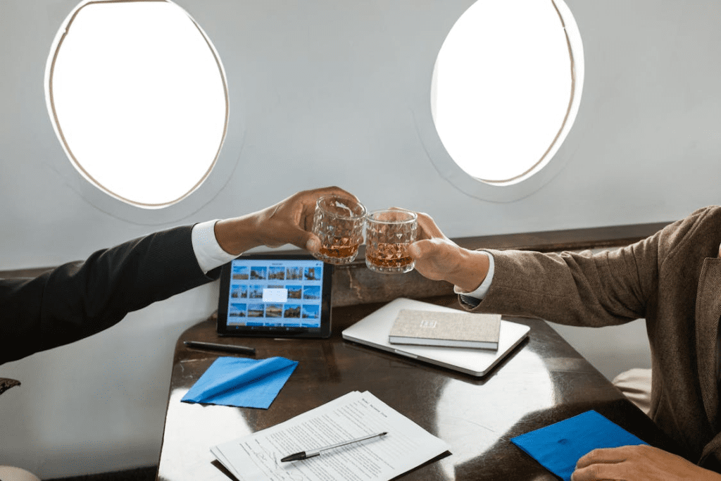 People having drinks in a private jet flight